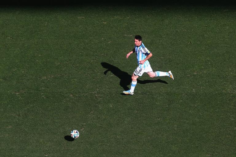 SAO PAULO, BRAZIL - JULY 01:  Lionel Messi of Argentina runs with the ball during the 2014 FIFA World Cup Brazil Round of 16 match between Argentina and Switzerland at Arena de Sao Paulo on July 1, 2014 in Sao Paulo, Brazil.  (Photo by Alexander Hassenstein - FIFA/FIFA via Getty Images)